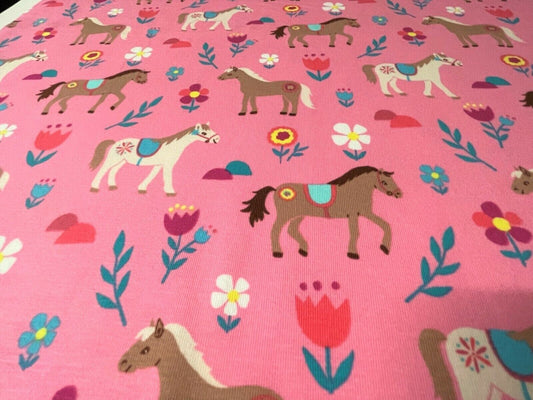 Baumwolle Jersey Stoff Pferde & Ponys rosa - Preis gilt für 0,50m Meterware